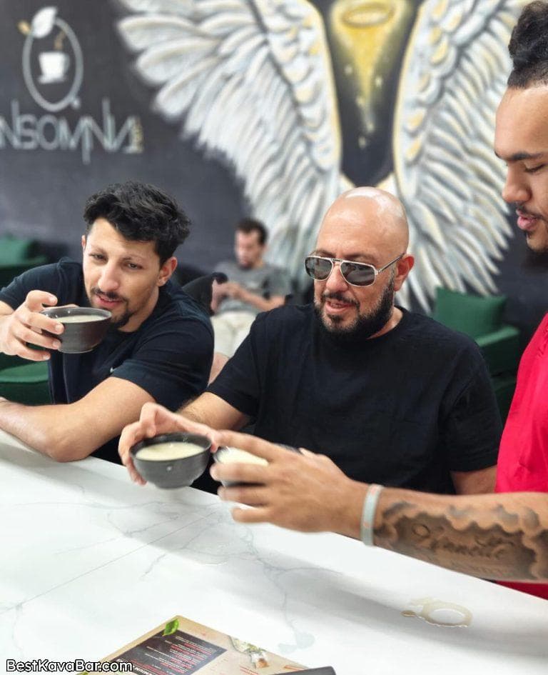 Kava bar guests sharing shells and conversation at the counter